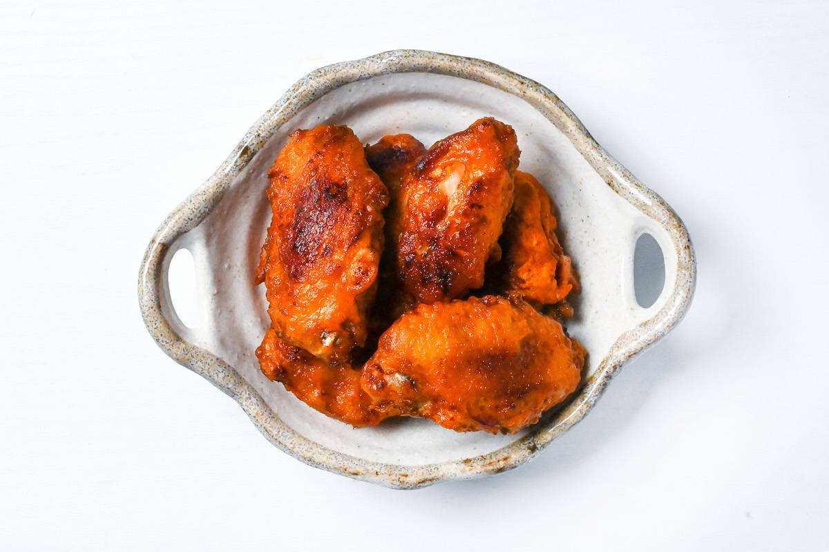 Karami chicken in a beige bowl with handles