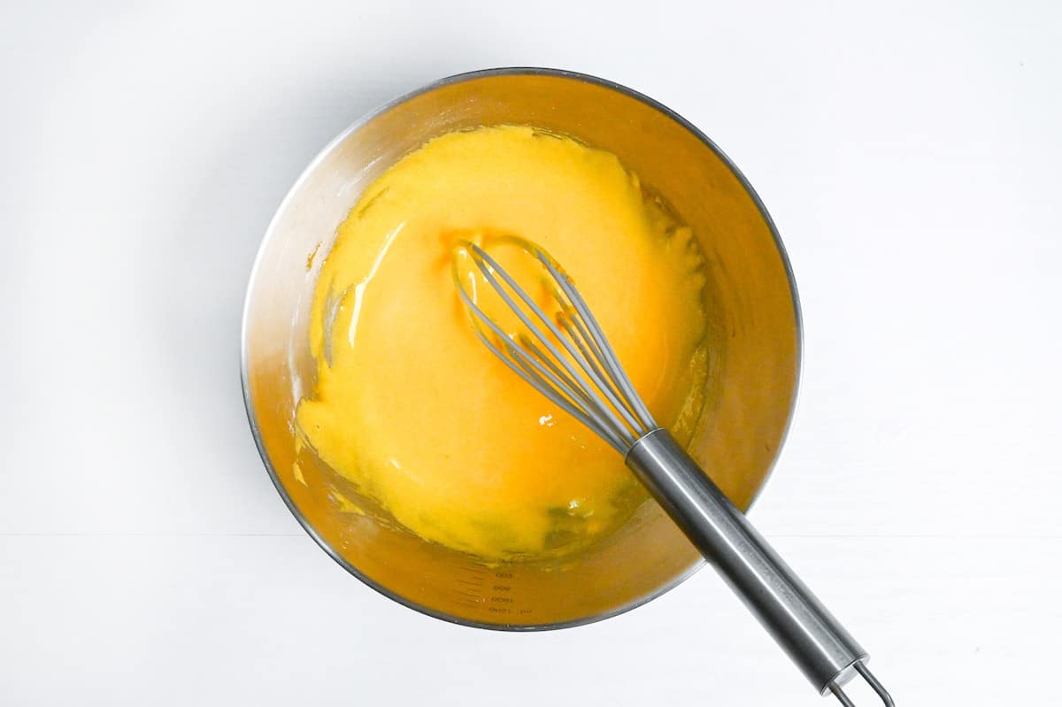 whisked egg yolks, sugar and cornstarch in a metal mixing bowl