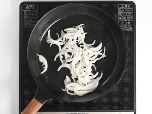 frying onion in a frying pan