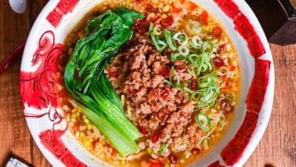 Spicy Japanese style tantanmen ramen in a red and white bowl