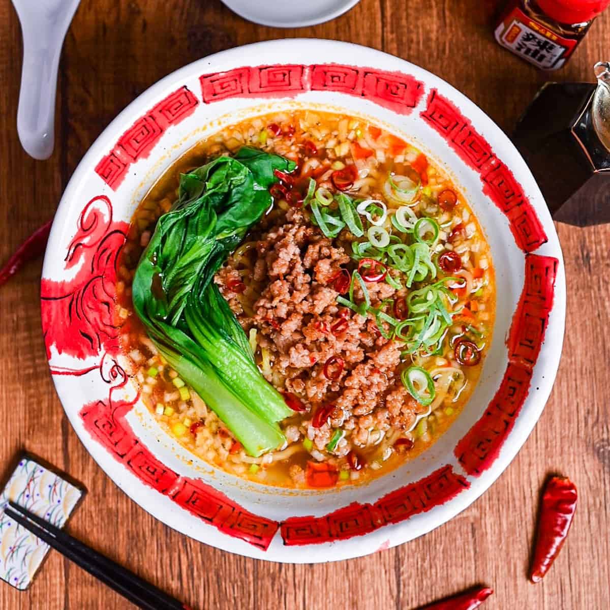 Spicy Japanese style tantanmen ramen in a red and white bowl