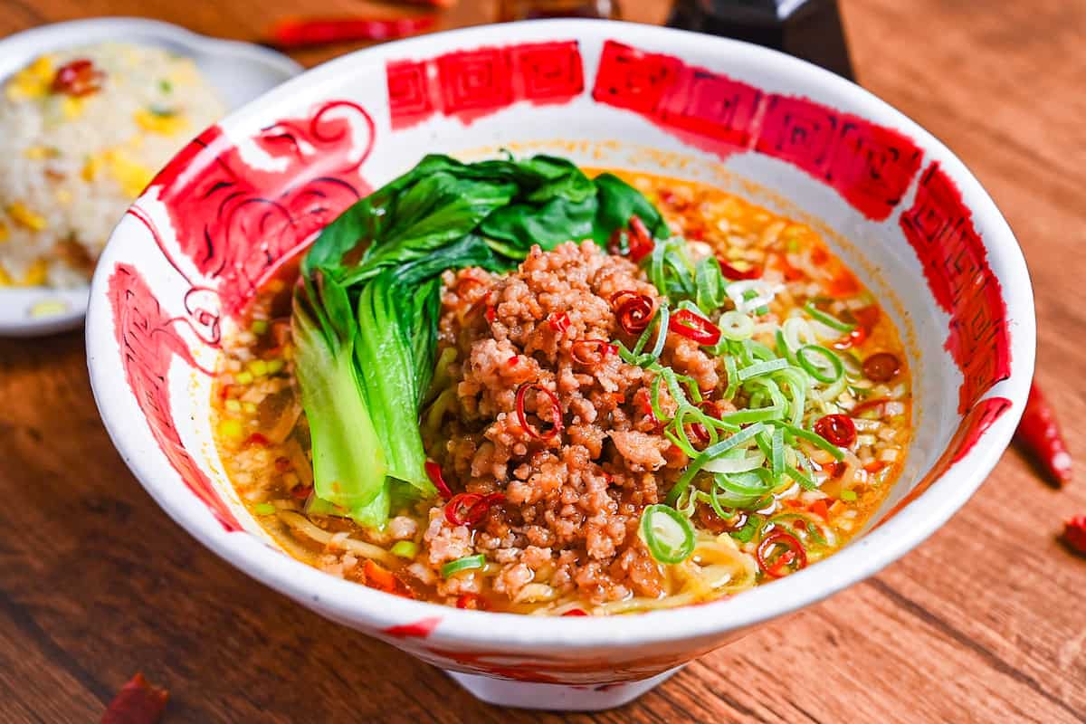 Spicy Japanese style tantanmen ramen in a red and white bowl