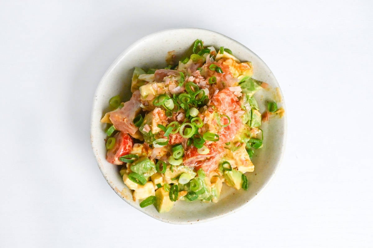 Japanese-style avocado salad topped with bonito flakes and green onions