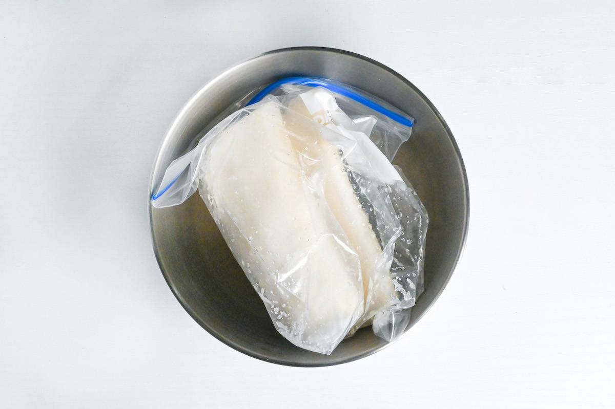 daikon radish with salt in a sealable freezer bag in a mixing bowl