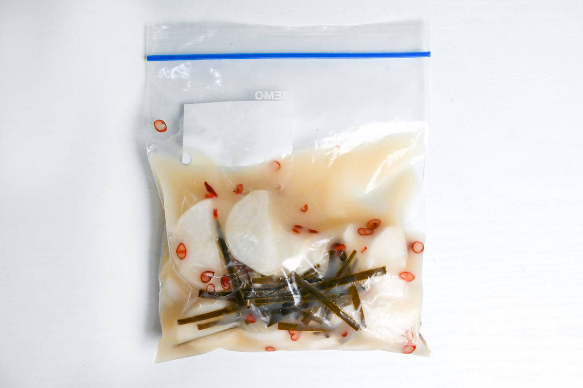 daikon radish in a sealable freezer bag with amazake, kombu, dried chili, sugar and salt.
