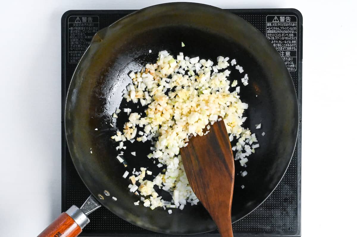 frying onion, garlic and ginger in a pan