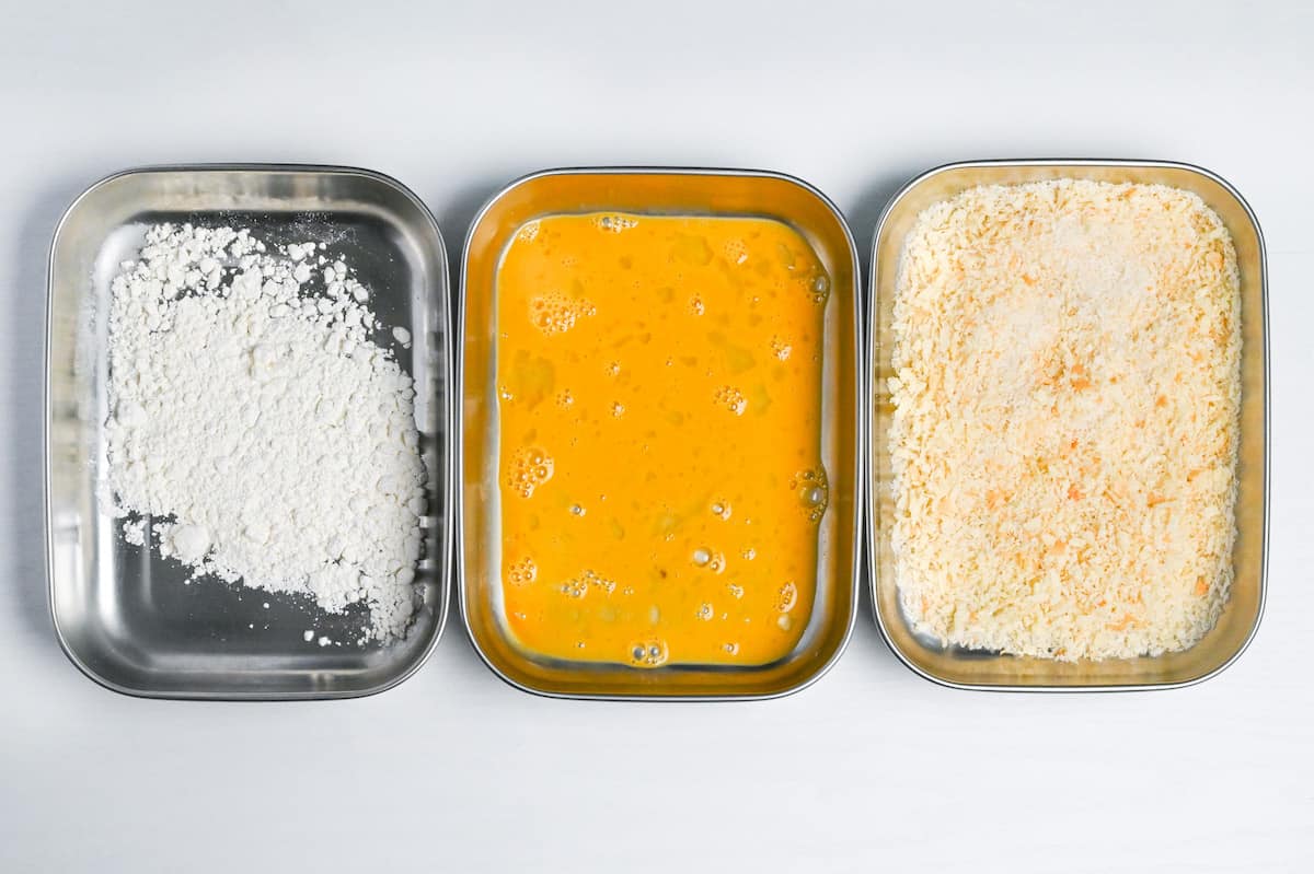 3 trays holding flour, whisked egg and panko