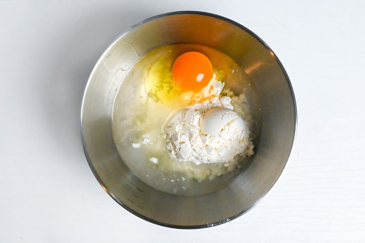 flour, egg and water in a steel mixing bowl to make batter