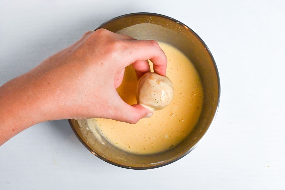 coating kabocha korokke in batter