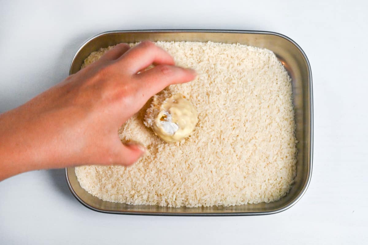 rolling kabocha korokke in panko breadcrumbs