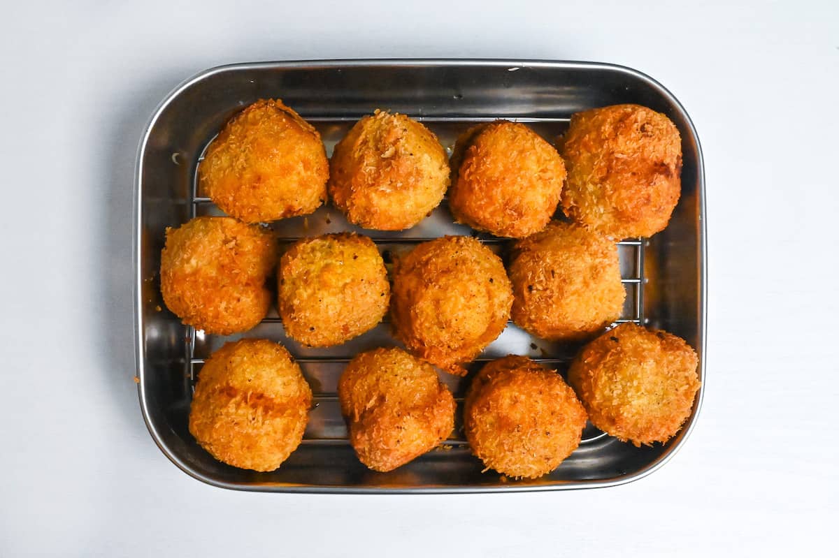 kabocha korokke draining on a wire rack