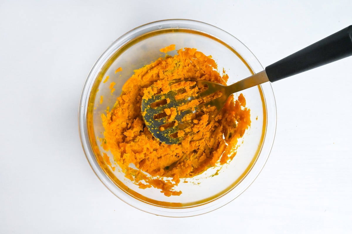 mashed kabocha in a glass bowl