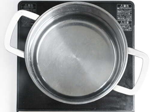 water in a large steel pot on the stove