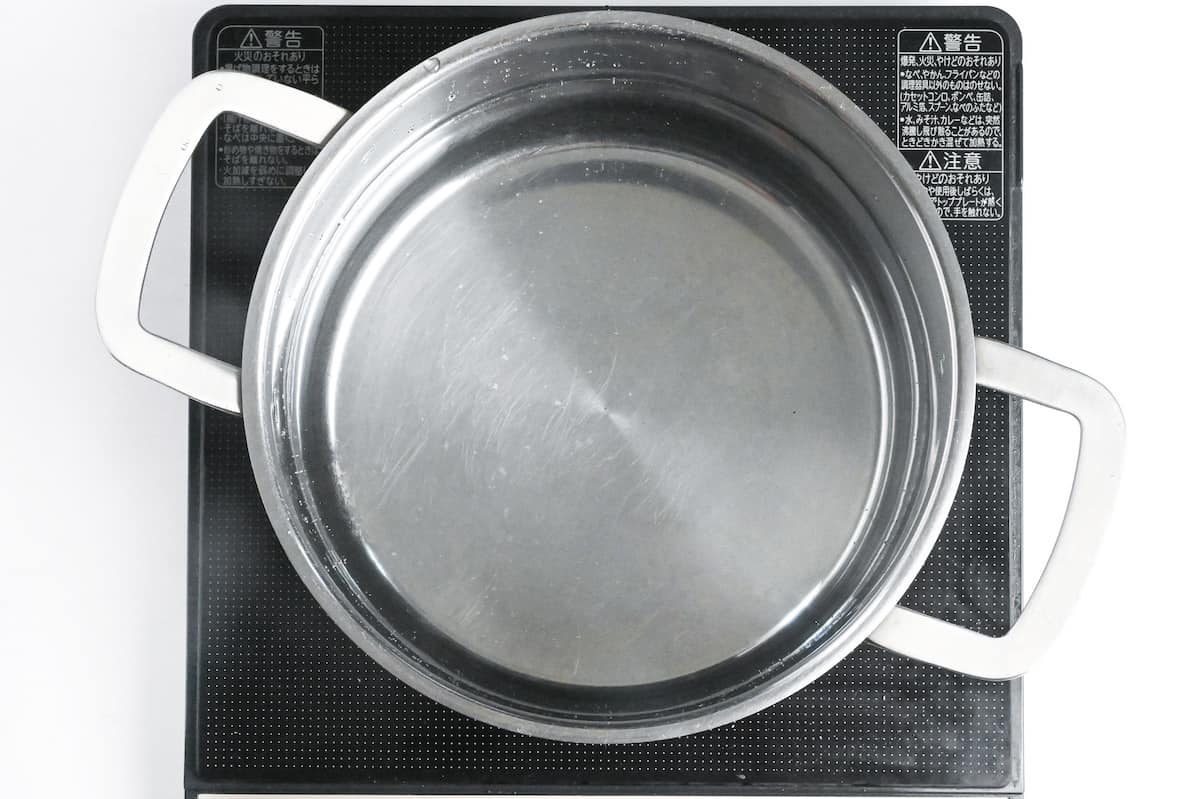 water in a large steel pot on the stove