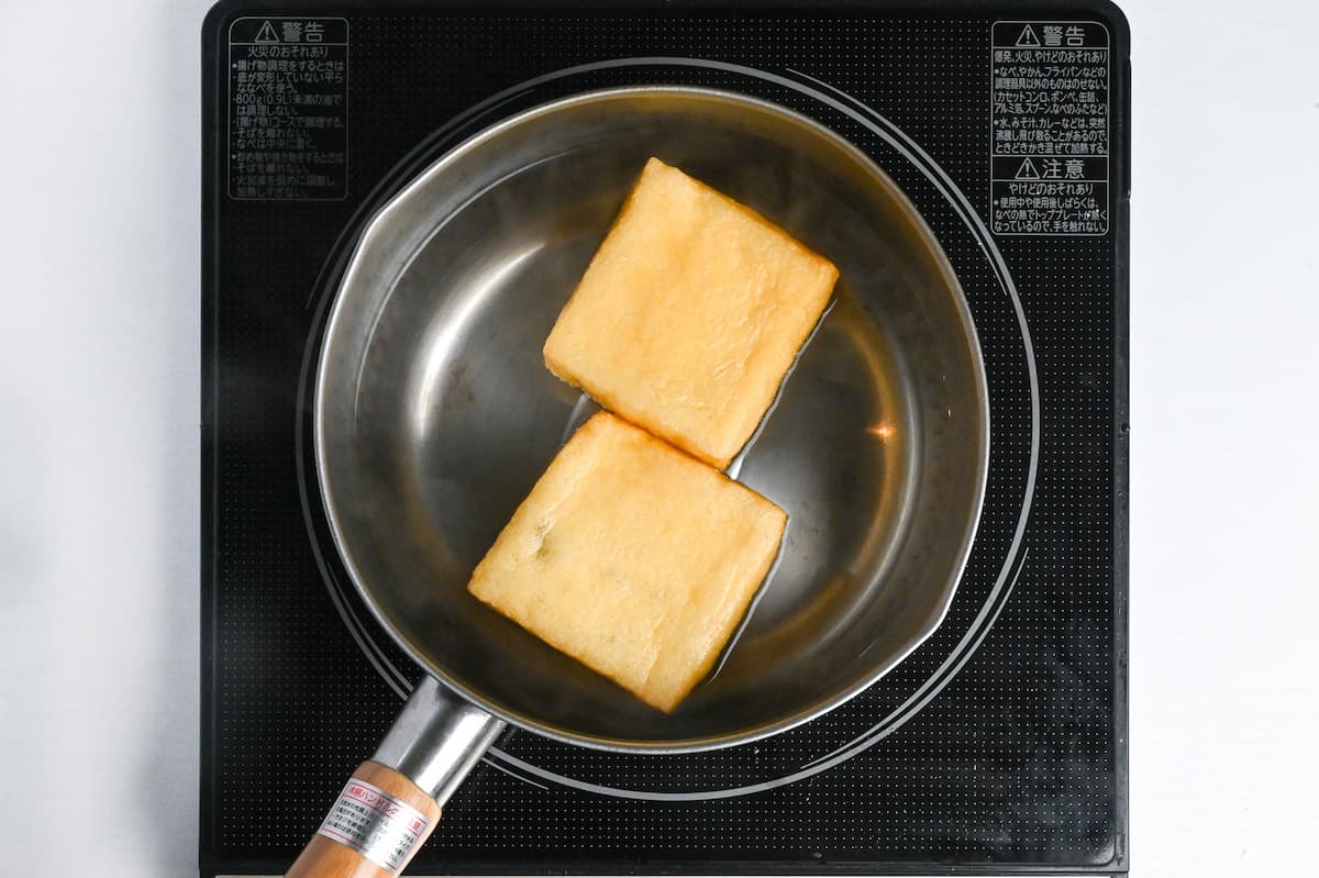 boiling deep fried tofu pouches in water