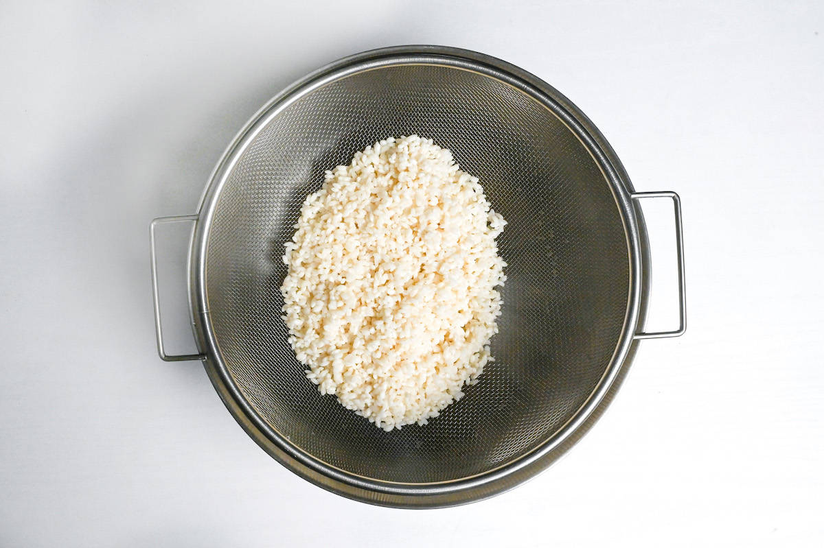 drying mochigome in a fine mesh sieve over an empty bowl