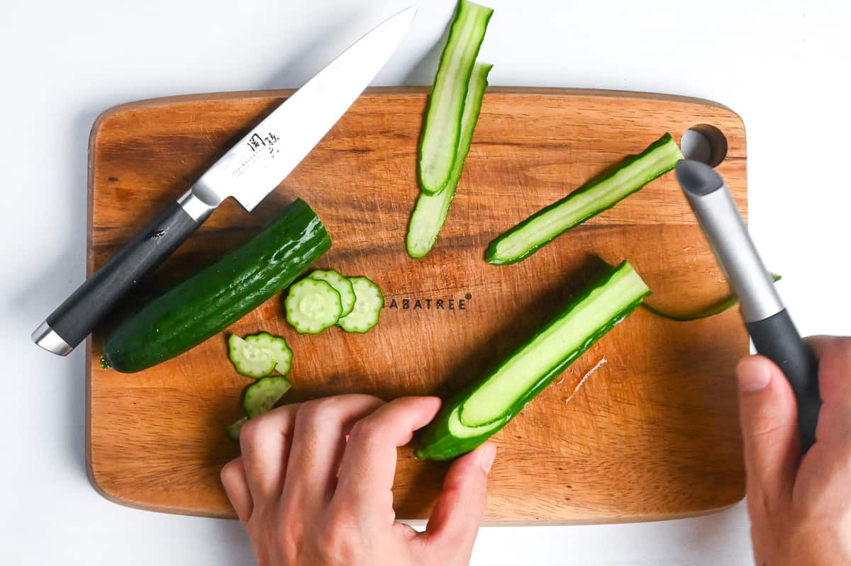 thinly slicing cucumber with a peeler to use for temarizushi