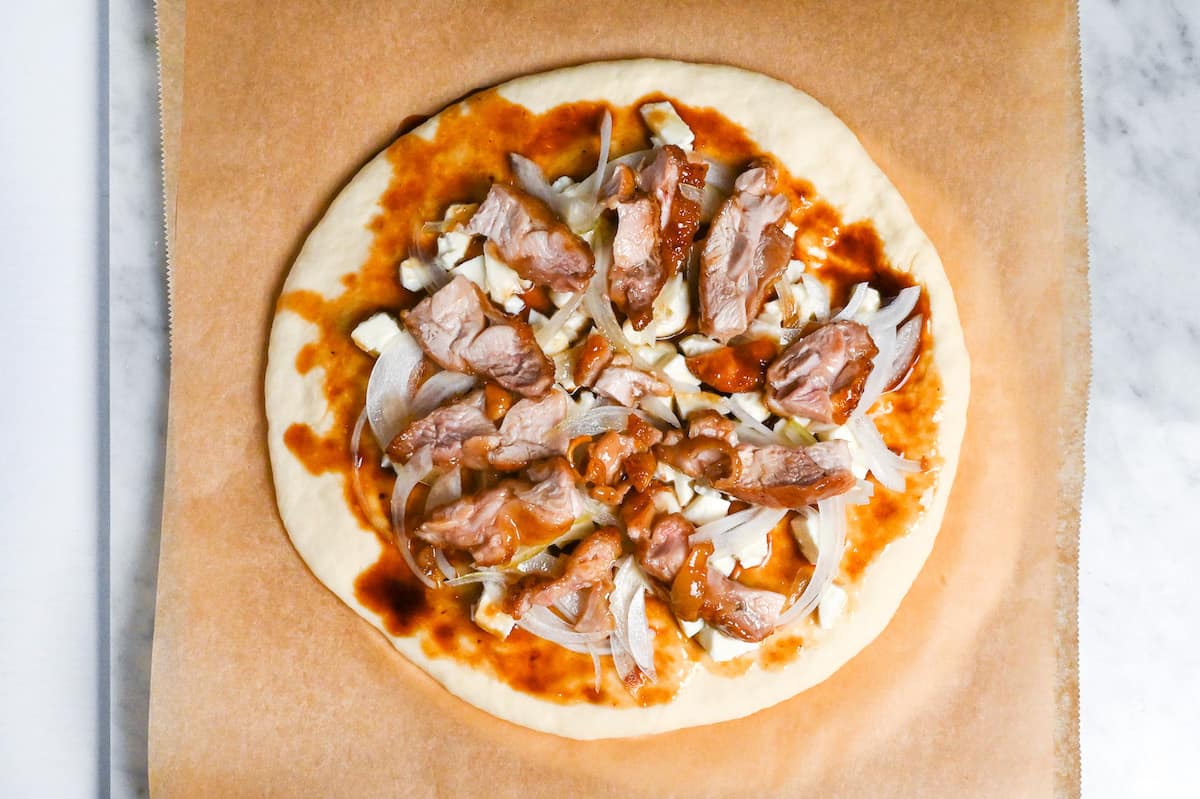 pizza topped with teriyaki chicken