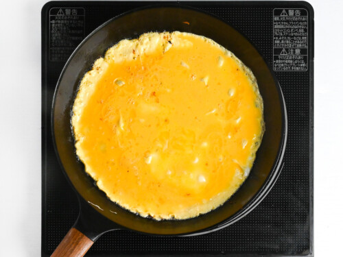egg omelette frying in a pan