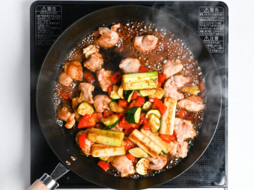 chicken and vegetables cooking in a yakitori style sauce