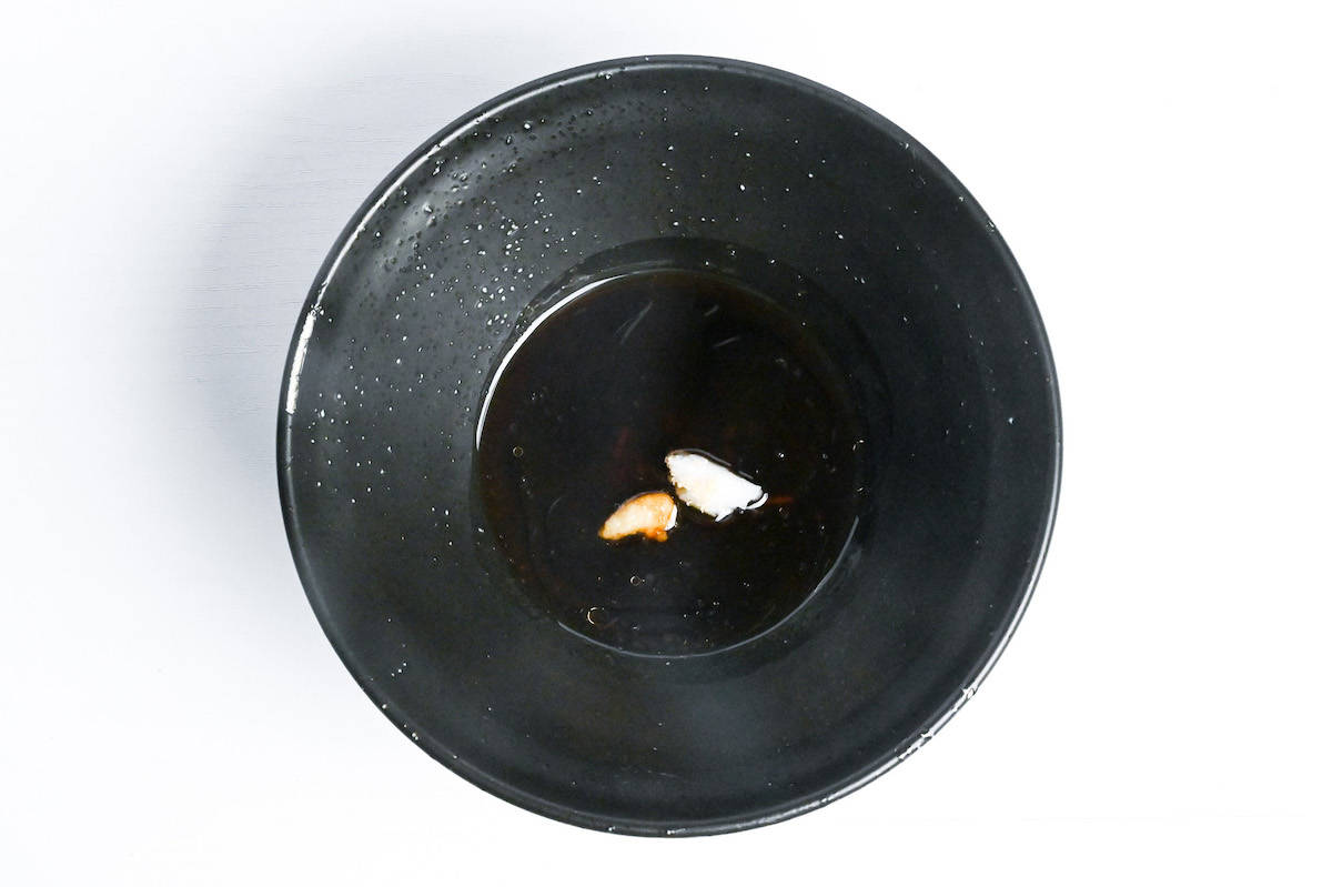 abura soba tare in a black bowl