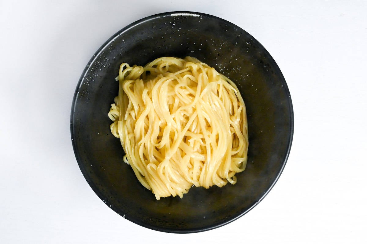 cooked ramen noodles placed on top of abura soba tare