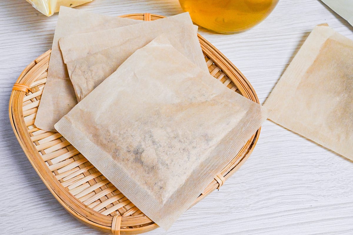 close up of dashi packets on a bamboo tray