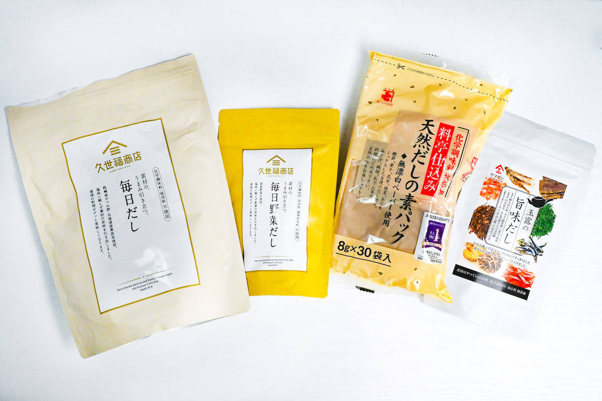 4 different brands of dashi packets on a white background