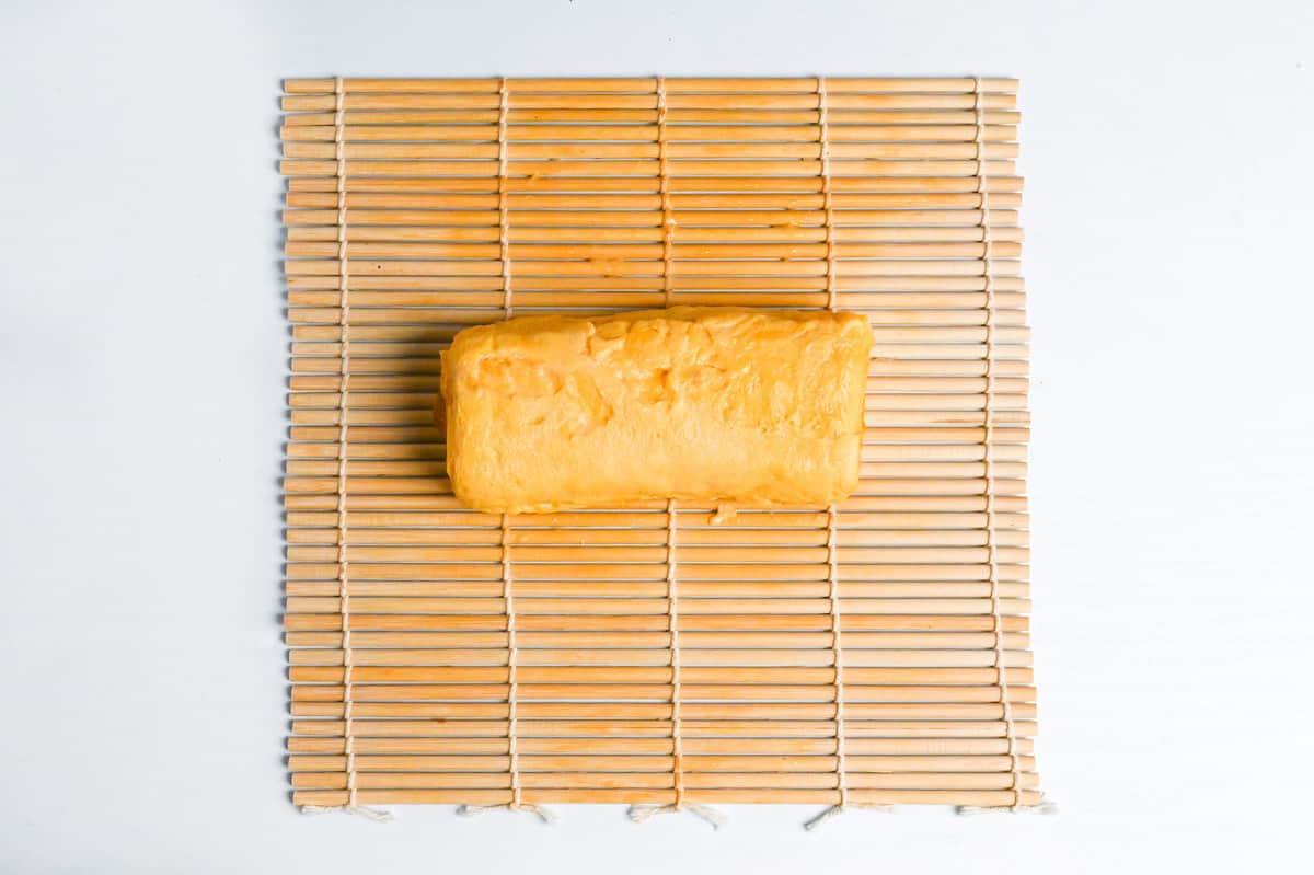 dashimaki tamago on a bamboo sushi mat