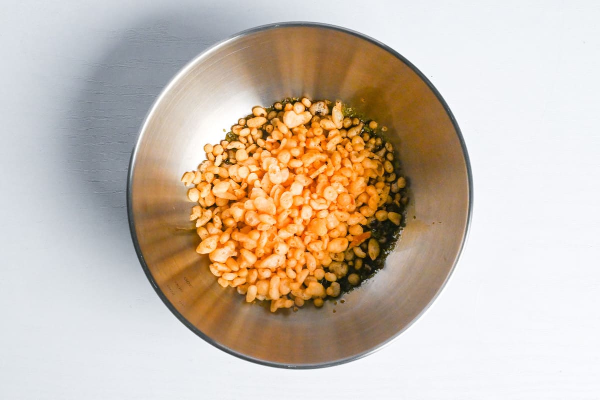 tempura flakes, aonori and tsuyu sauce in a mixing bowl