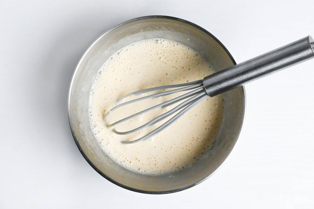 ebi mayo batter whisked in a steel mixing bowl
