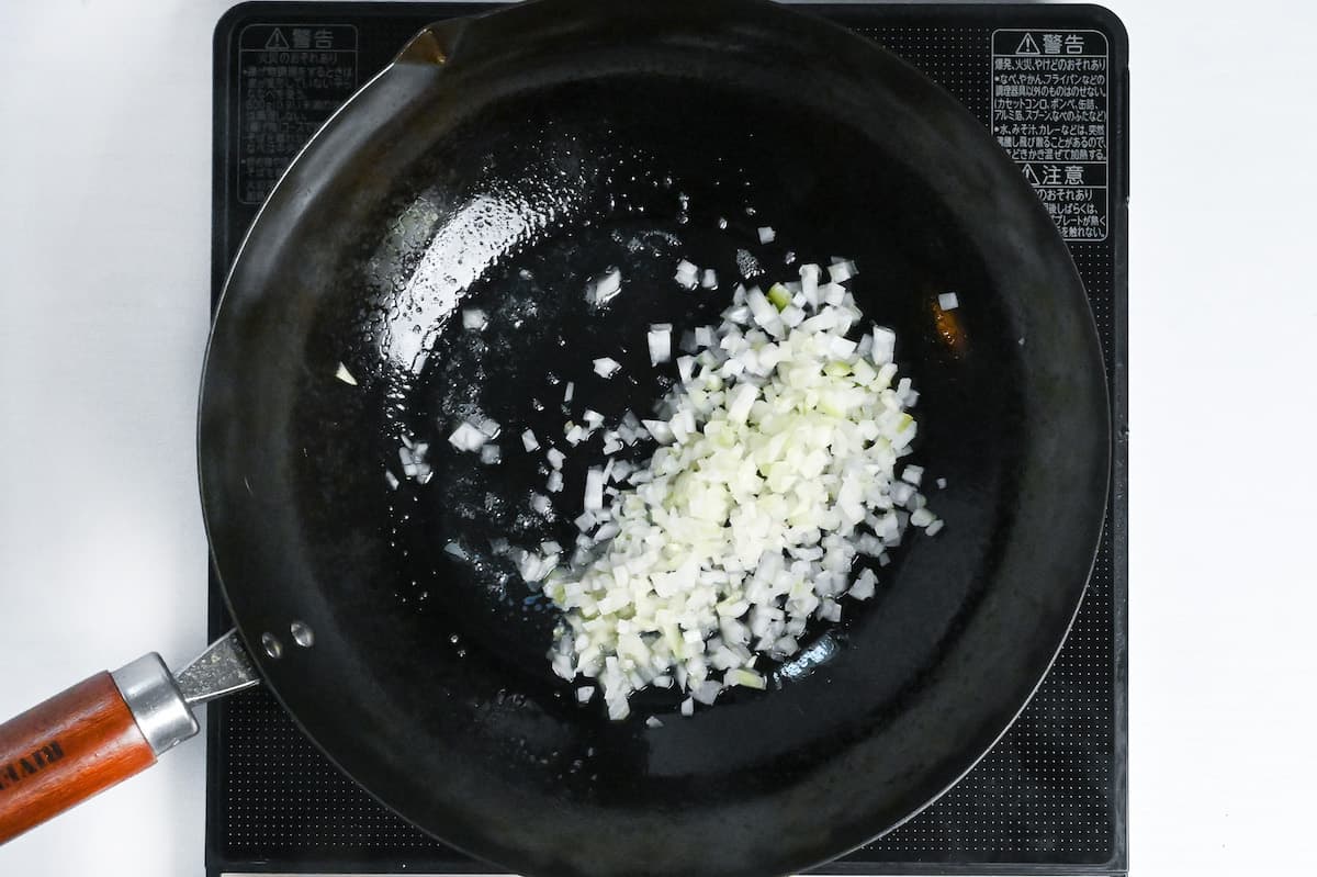 finely diced onions in a pan