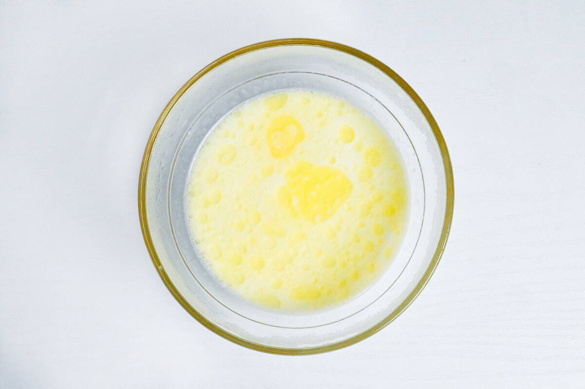 milk and melted butter in a bowl