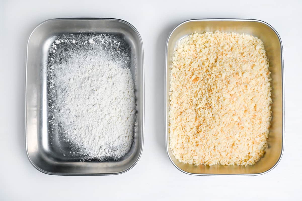 flour and panko breadcrumbs in steel trays