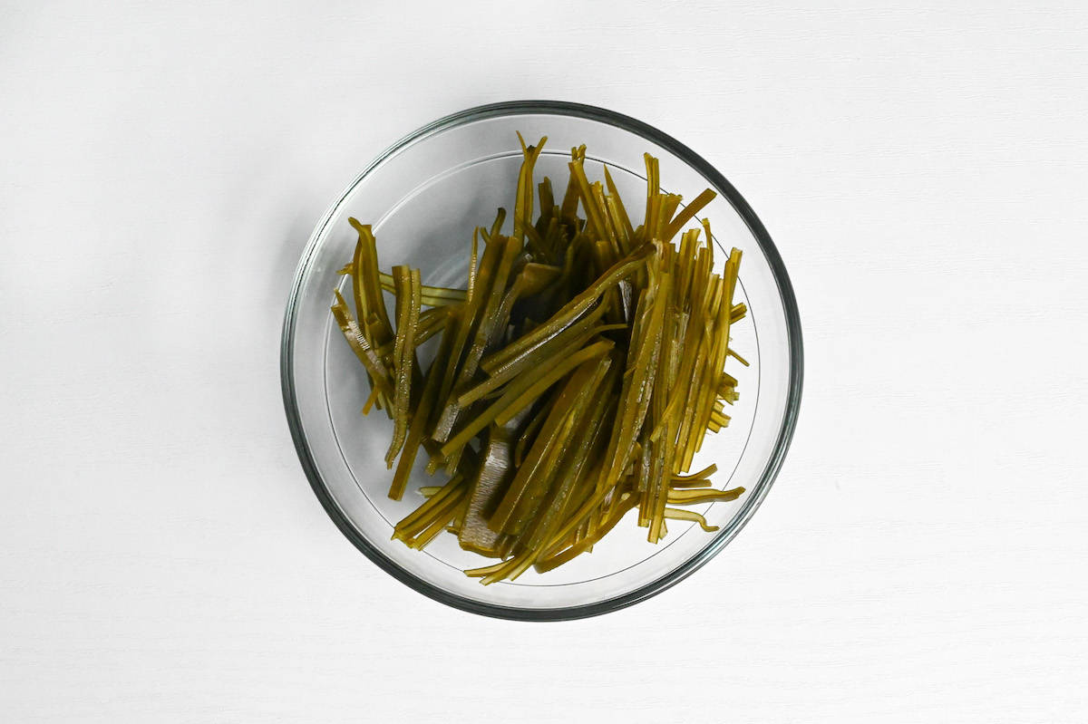 rehydrated kombu cut into matchsticks (julienned) in a glass bowl