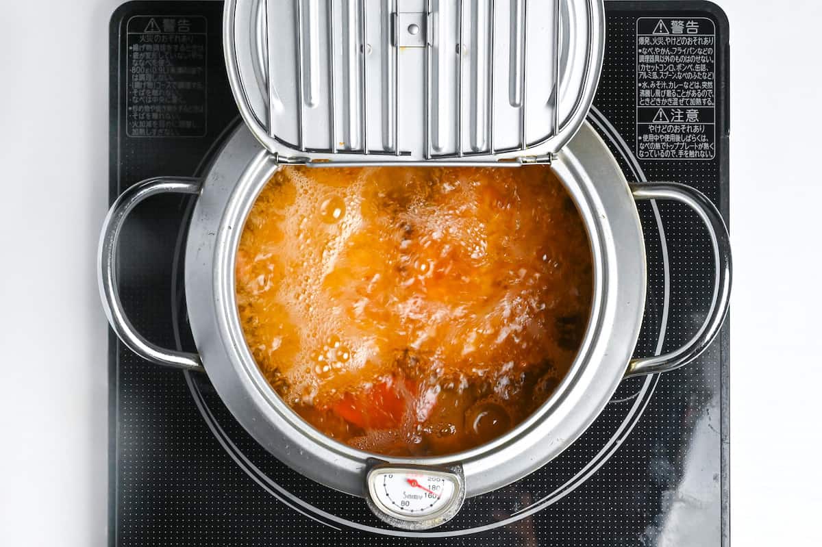 korokke deep-frying in a Japanese style fryer