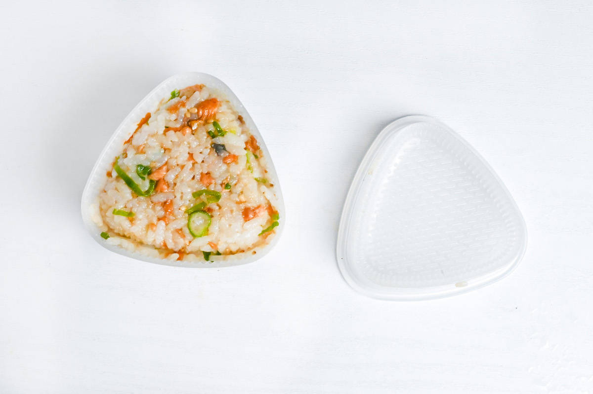 salmon onigiri mixture shaped in an onigiri (rice ball) mold