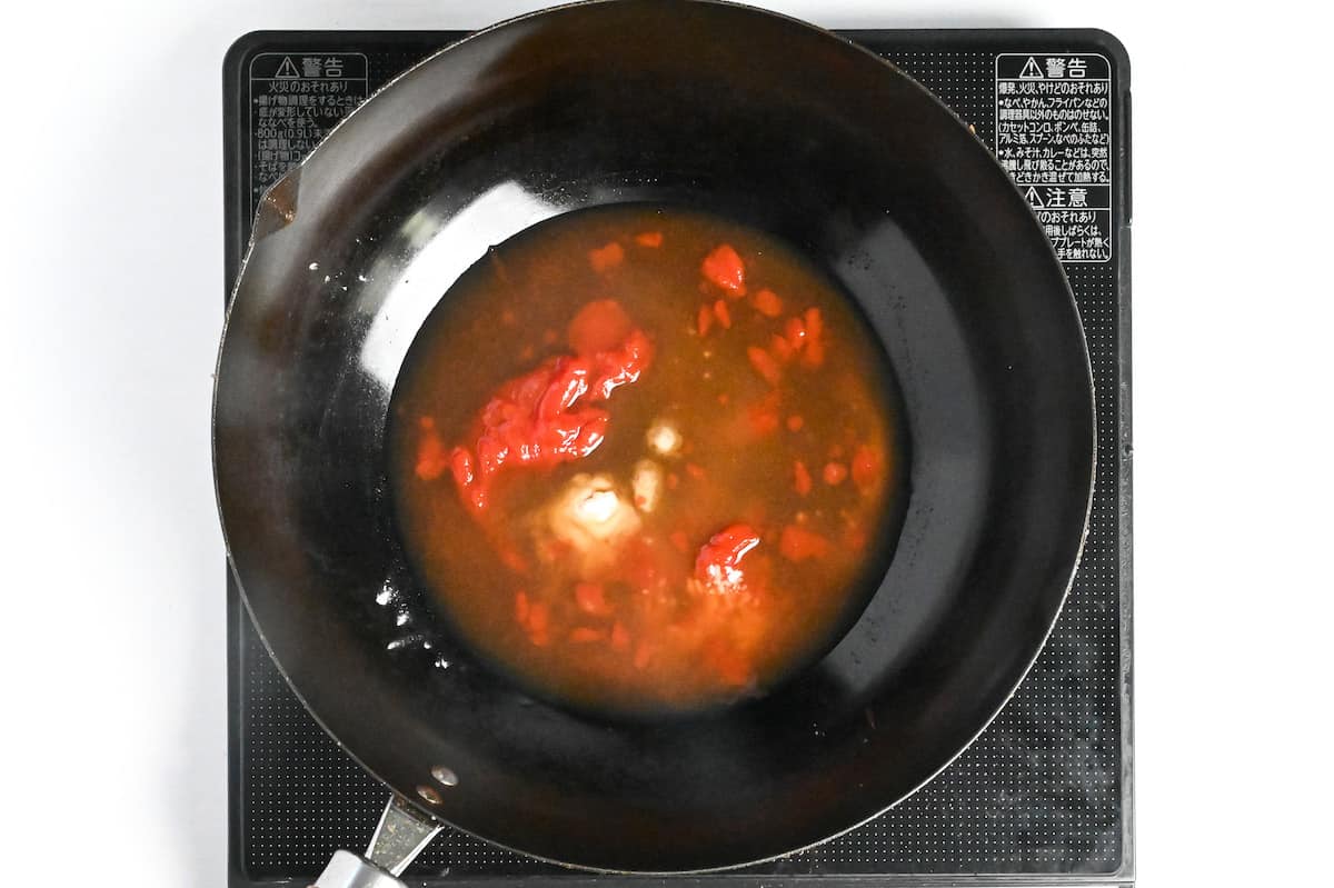 condiments in a wok to make subuta (Japanese sweet and sour) sauce