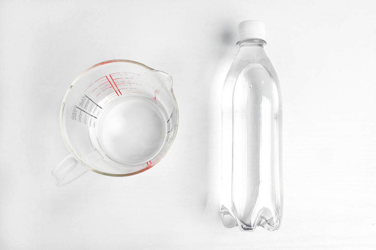 Still water in a jug and sparkling water in a sealed bottle