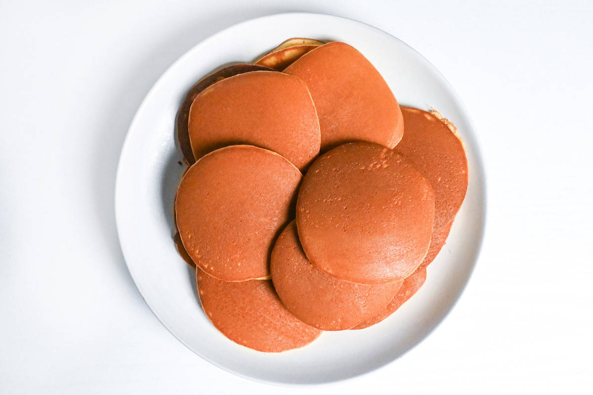 dorayaki pancakes stacked on a white plate
