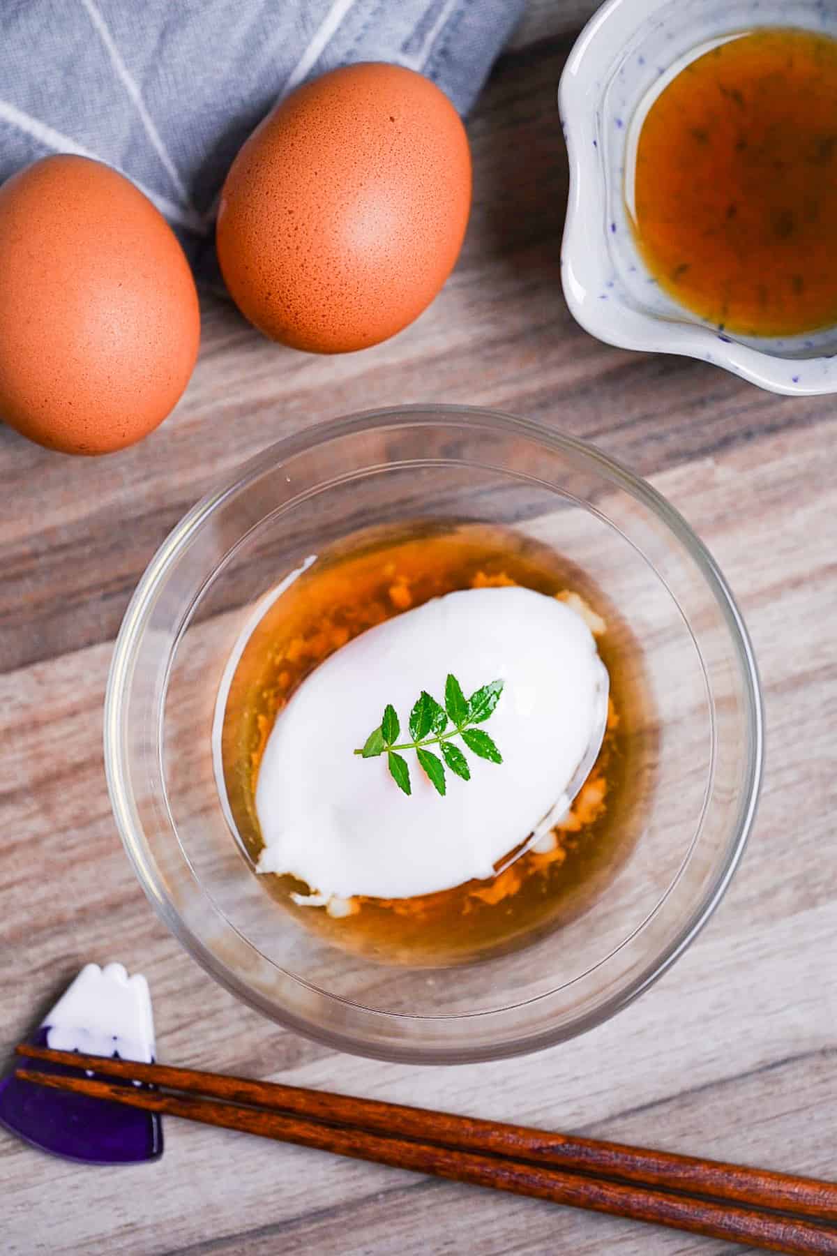 onsen tamago (Japanese hot spring egg) in a glass bowl with sauce