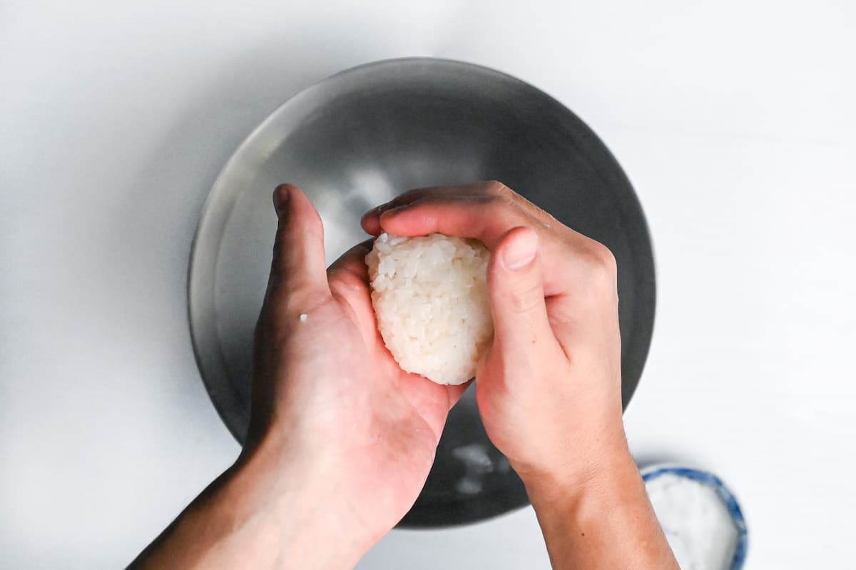 shaping onigiri rice ball by hand