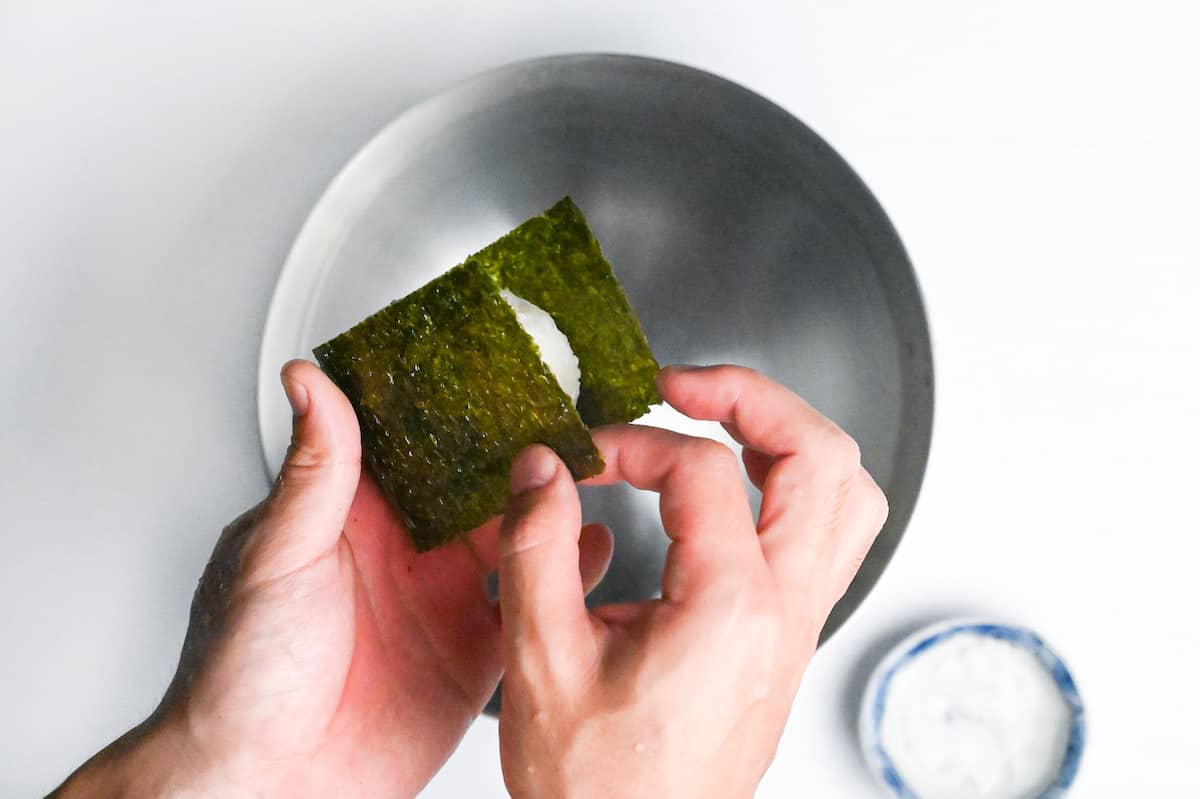 hand shaped shio onigiri rice ball wrapped with nori seaweed