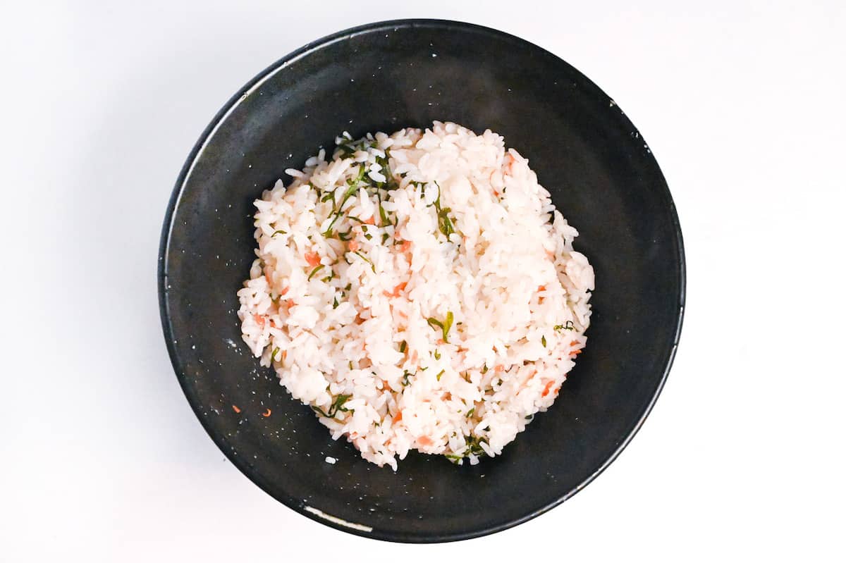 umeboshi and shiso flavored rice in a black bowl