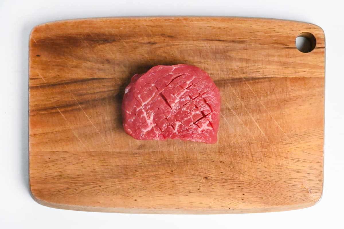 tenderized steak with scored surface