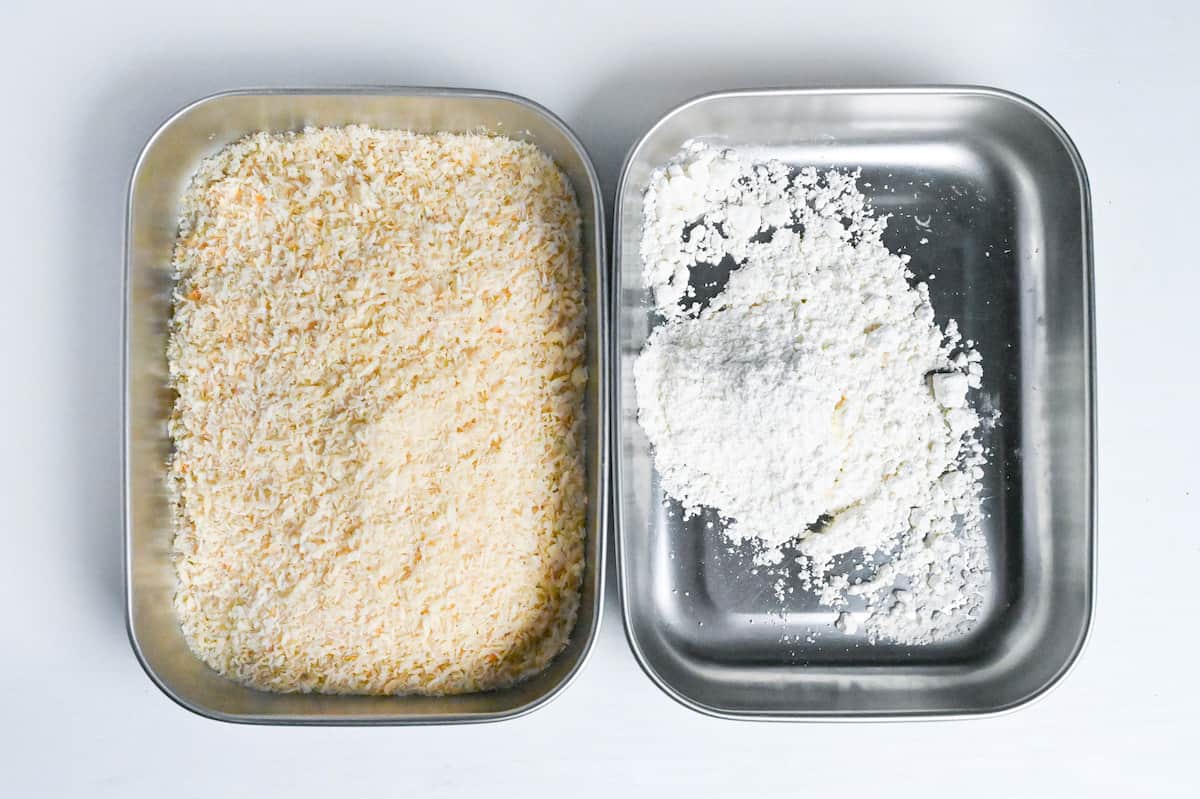panko breadcrumbs and flour in steel trays