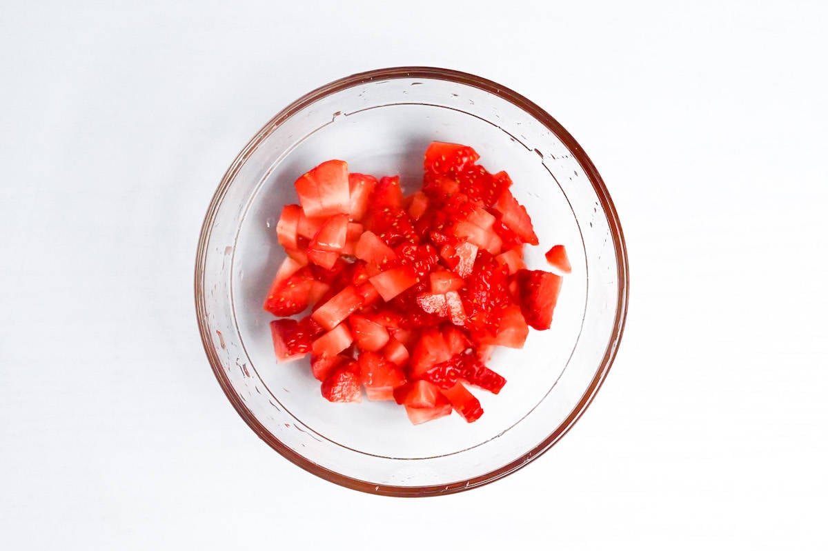 fresh strawberries finely diced in a small glass bowl