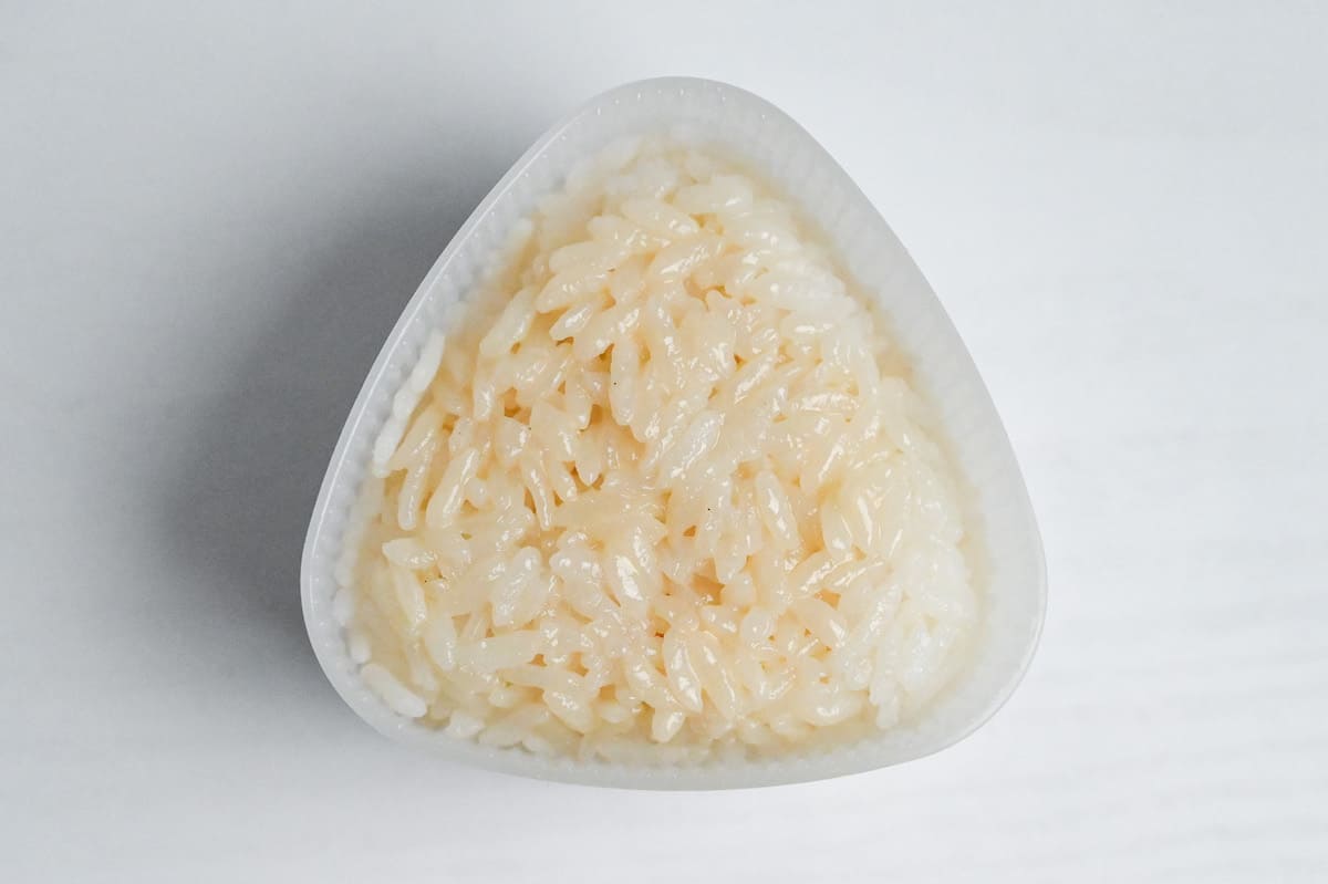 Tuna mayo filling wrapped with rice in a plastic onigiri mold