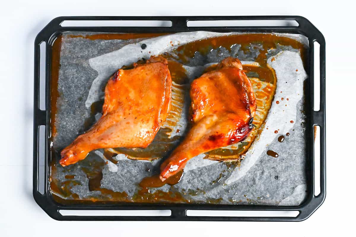 cooked Japanese Christmas chicken with glossy glaze on a sheet pan