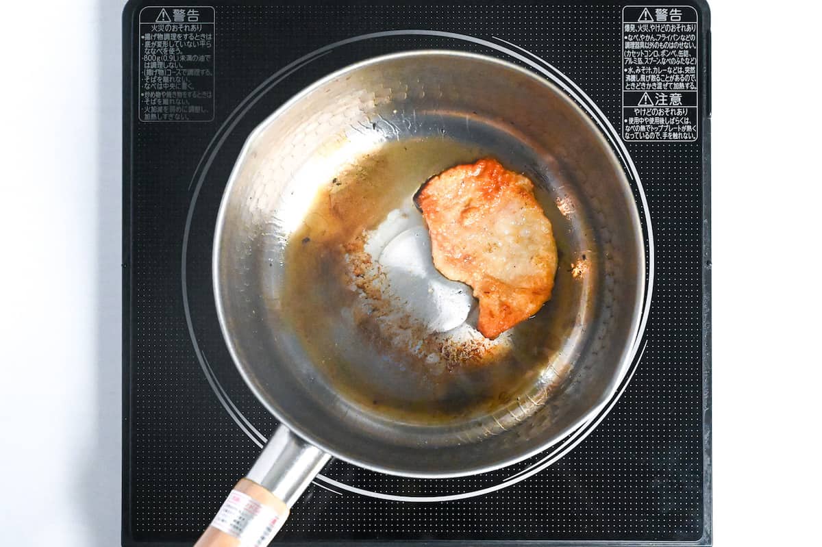 rendering chicken skin in a pan
